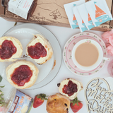 Fruit & Plain Scone Cream Tea, picture from above of scones, cream, jam and tea.