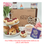 Fruit & Plain Scone Cream Tea, scones with cream and jam displayed on cake stand with free Willies chocolate.