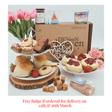 Afternoon cream tea hamper with scones, cream, jam, tea, flapjack, brownie, shortbread and free fudge.